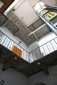 a ceiling of a building with a metal staircase at Casa Da Vinci B&B in Locarno