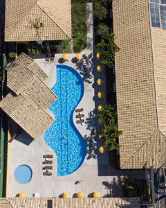 an overhead view of a swimming pool at a resort at Sunshine Praia Hotel in Porto Seguro