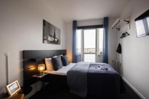 Uma cama ou camas num quarto em Milling Hotel Gestus