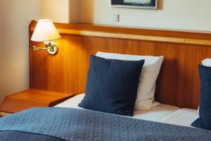 Uma cama ou camas num quarto em Milling Hotel Gestus