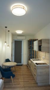 A kitchen or kitchenette at Napsugár Club és Panzió Még 37 kép