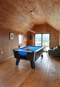 a room with a pool table in a house at Keeper's Cottage, Straloch Estate in Perth