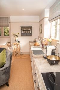a kitchen with a sink and a counter top at No.3 The Old Coach House in Blockley