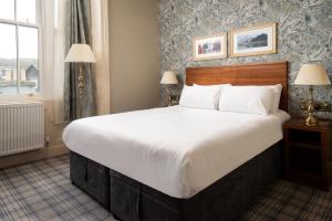 a bedroom with a large bed and a window at The Temperance Inn, Ambleside - The Inn Collection Group in Ambleside