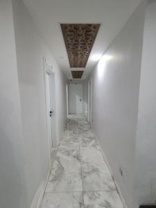 a hallway with white walls and a ceiling at dara otel in Midyat