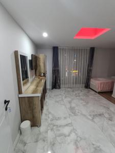 a bathroom with a large marble floor and a red ceiling at Dara Otel in Midyat +31 photos