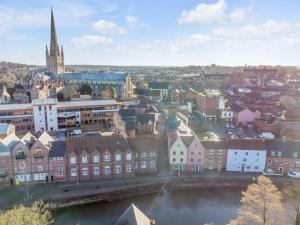 an aerial view of a city with a river and buildings at Seven Space Central Town House with Parking in Norwich