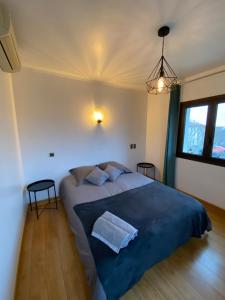 Ένα ή περισσότερα κρεβάτια σε δωμάτιο στο Les Chambres de la bourse +9 φωτογραφίες