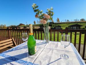 a bottle of wine and two glasses on a table at The Fairhaven in Richmond