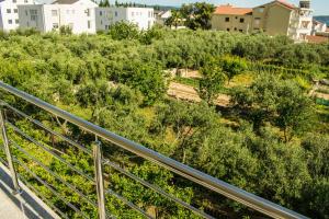 an overhead view of a hill with trees and buildings at Apartments Villa Ornamenta - 5min to beach - free parking in Kaštela