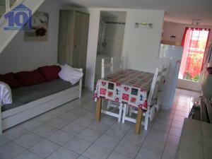 a room with a table and a bed and a kitchen at Maison Valras-Plage, 3 pièces, 6 personnes - FR-1-781-6 in Valras-Plage