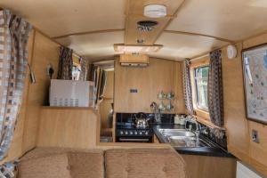 an interior view of a kitchen in a rv at Wren Class at Gayton Marina in Northampton