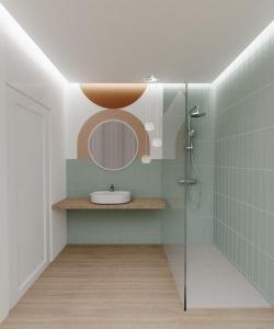ein Bad mit einer Dusche, einem Waschbecken und einem Spiegel in der Unterkunft Villaggio Costa Real in Capo Vaticano