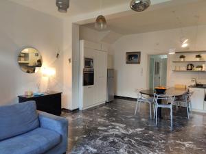 a living room with a couch and a table at Casa Stella in Viareggio