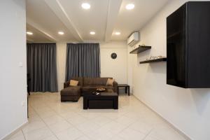 a living room with a couch and a coffee table at Hestia Apartment! in Thessaloniki