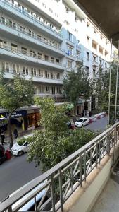 a view of a city street with a large building at Athens Tales Residence Syntagma Athens in Athens