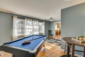 a pool table in a living room with a table at Spacious Starkville Home 4 Mi to MSU Campus in Starkville