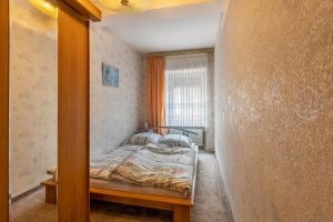 Ένα ή περισσότερα κρεβάτια σε δωμάτιο στο Ferienwohnung im Harz