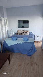 a bedroom with two beds and a flat screen tv at Beach Life Carabassi Beach Gran Alacant in Gran Alacant
