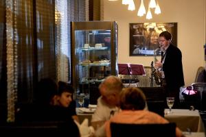 a woman playing a saxophone in a restaurant at D` Hotel VDNKH in Moscow