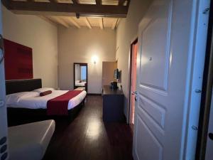 Voodi või voodid majutusasutuse OneMhotel toas