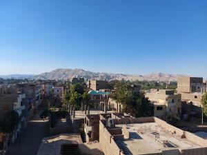 a view of a city with mountains in the background at Luxor apartment in Luxor