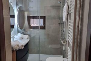 a bathroom with a shower and a toilet and a sink at Holiday home in Lokve, Croatia 47707 in Lokve