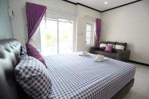 Postel nebo postele na pokoji v ubytování MB House Resort + 31 fotografií