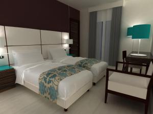 Postel nebo postele na pokoji v ubytování Hotel Sagittario