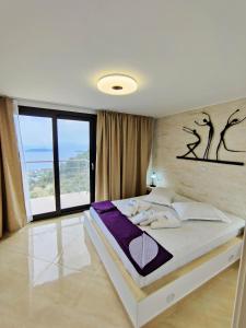 Postel nebo postele na pokoji v ubytování Sky Sea Resort & Villas + 37 fotografií