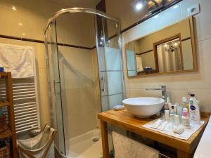 a bathroom with a sink and a shower at One-Bedroom Apartment by the Eiffel Tower: your home in the heart of Paris in Paris