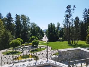 a view of a park from a balcony at Tivoli Boutique Inn in Ljubljana