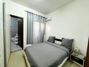 Postel nebo postele na pokoji v ubytování Maison fonctionnelle idéalement située à Dakar
