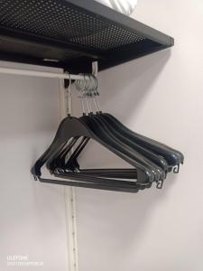 a black rack with utensils hanging from it at GS Latina in Madrid