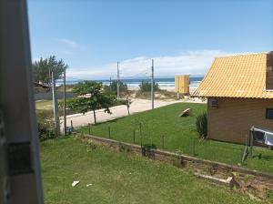 a view of the beach from a house at Apartamentos Beira Mar in Laranjal
