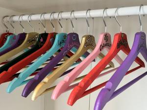 a bunch of colored utensils hanging on a rack at La MAGIA NEL BORGO in Fezzano