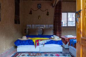 a bedroom with two beds in a room at Atlas Views in Imlil