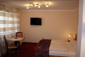 Postel nebo postele na pokoji v ubytování Hotel & Weinstube Restaurant Filling