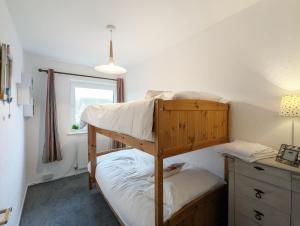 a bedroom with two bunk beds and a desk at Family Home in Rustington, West Sussex in Rustington