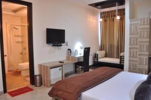 Postel nebo postele na pokoji v ubytování Solo Victoria Hotel