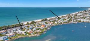 an aerial view of a resort on a beach at Island Hideaway steps to beach dock Bridge St in Bradenton Beach
