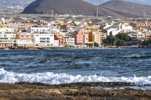 a view of a city from the water at Daydream Medano Coliving in El Médano