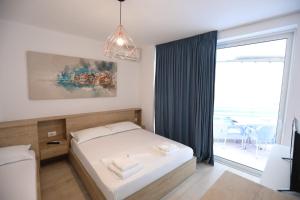 Postel nebo postele na pokoji v ubytování Apart-Hotel Alvi + 37 fotografií