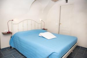 A bed or beds in a room at U Campanin