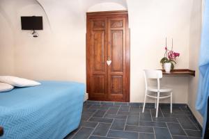 A bed or beds in a room at U Campanin