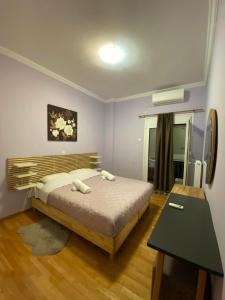 Ένα ή περισσότερα κρεβάτια σε δωμάτιο στο Kultur apartment Athens
