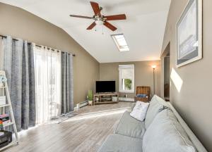 a living room with a couch and a ceiling fan at Downtown Westerly Home 4 Mi to Beaches! in Westerly