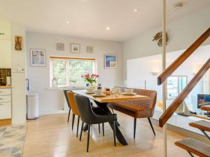 a kitchen and dining room with a table and chairs at 3 Bed in Brixham BX004 in Brixham