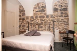 A bed or beds in a room at U Campanin