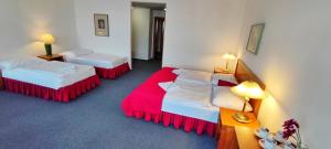 Ένα ή περισσότερα κρεβάτια σε δωμάτιο στο Hotel Magnolia